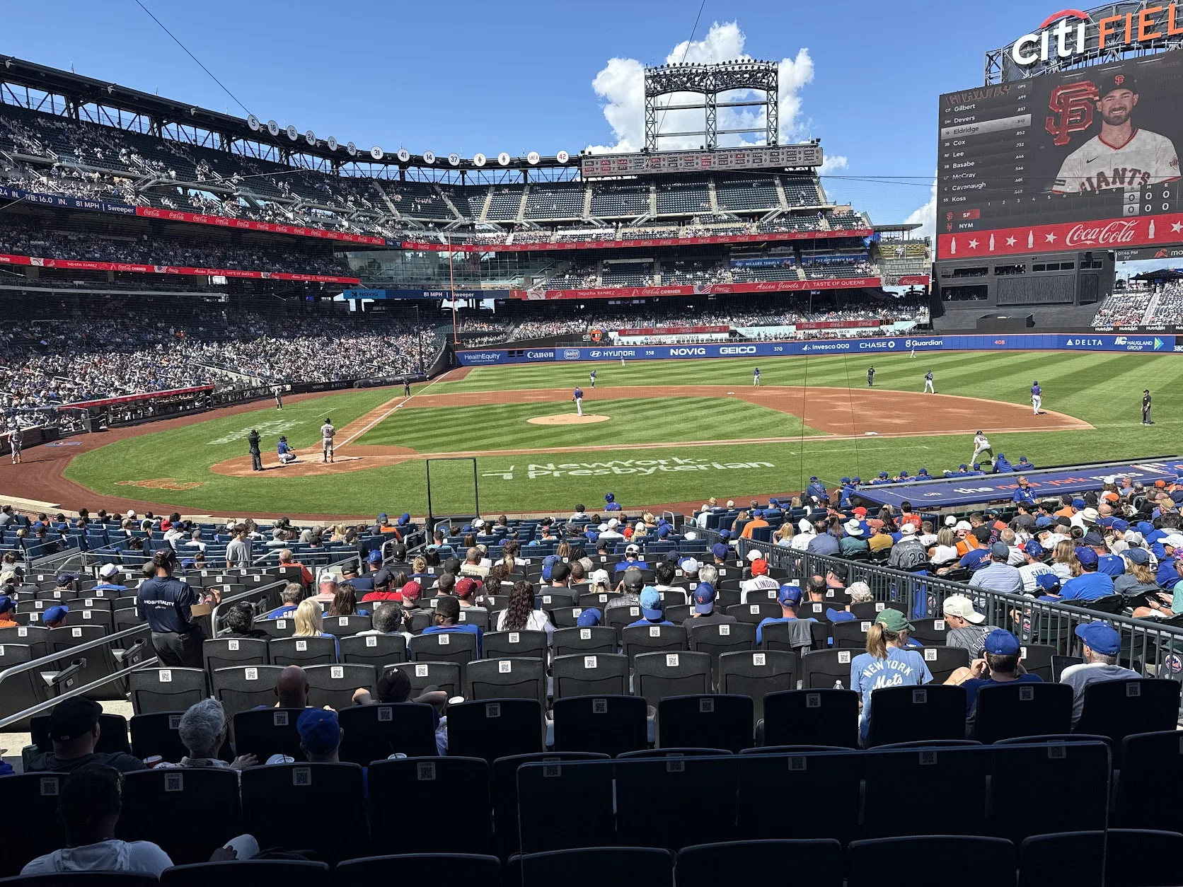 Citi Field from field level behind home plate, Mets against the Giants on a sunny afternoon